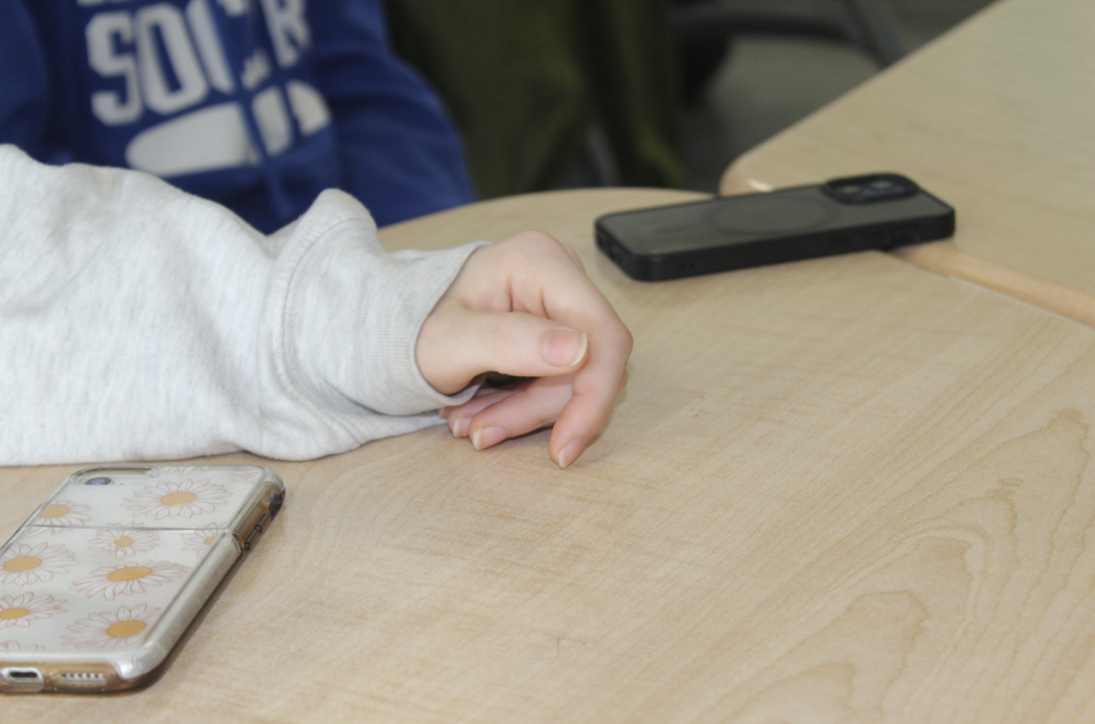 Haldane students in sit in class with their smartphones, which will be banned in school next year under a new state mandate.